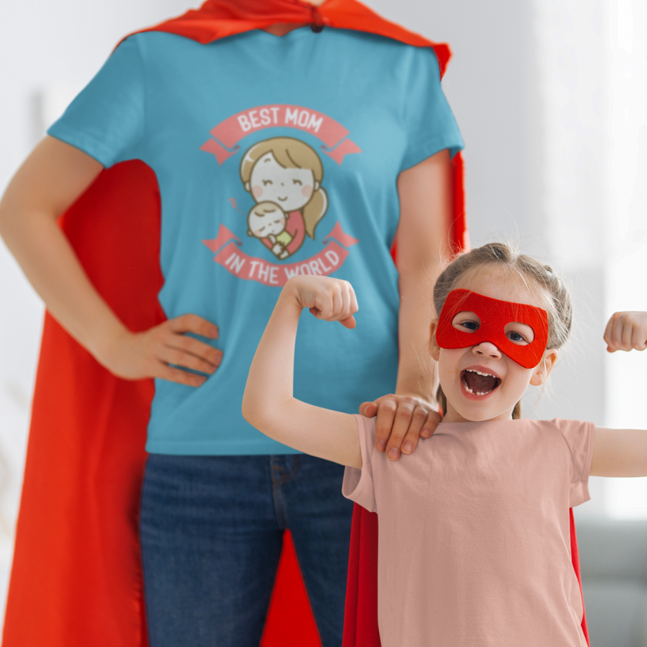 A proud mom dons her 'Best Mom in the World' heather aqua tee, while her little sidekick sports a matching heather peach tee. Together, they radiate love and superhero vibes