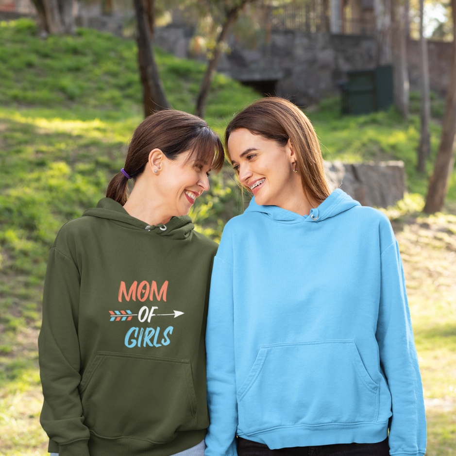 A mother and daughter share a cute moment in the garden. The girl wears a basic blue hoodie while the mother wears a military green hoodie themed as 'Mom of Girls'