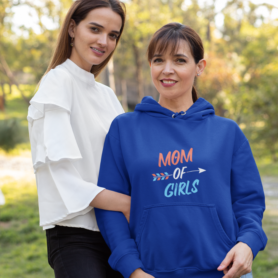 A mother and daughter share a cute moment in the garden. The girl wears a basic white top while the mother wears a royal blue hoodie themed as 'Mom of Girls'