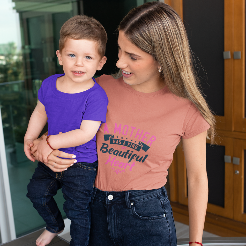 A mom wearing a peach T-shirt with a heartwarming design, gazing affectionately at his son , embodying the loving and nurturing spirit of motherhood.