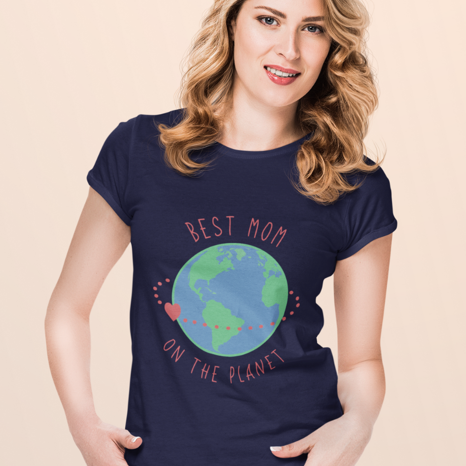 a blonde mom, adorned in a navy blue tee labeled 'Best Mom on the Planet', shares precious moments with her loved ones, embodying the essence of motherhood.